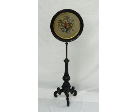 VICTORIAN ROSEWOOD POLE SCREEN
the circular glazed screen with a needlework panel of flowers, on an adjustable support and tr