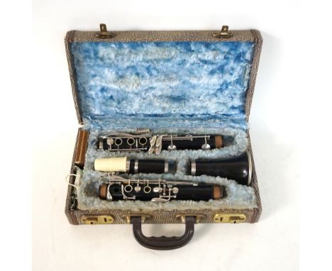 CASED CLARINET
in five ebonised sections, marked F.Buissom sole distributors Dallas London, with spare reeds  