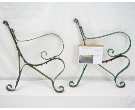 PAIR OF CAST IRON SHAPED GARDEN BENCH ENDS
with stretchers, 80cm high