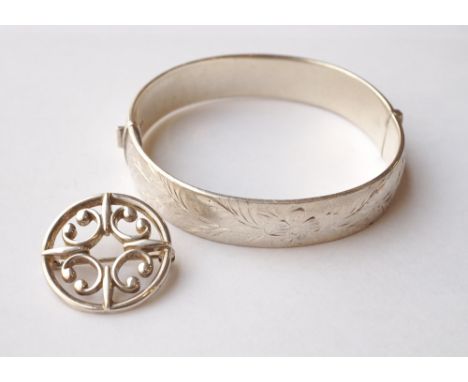 OLA GORIE SILVER CIRCULAR BROOCH
2.8cm diameter, and a 1970's engraved silver bangle (2)