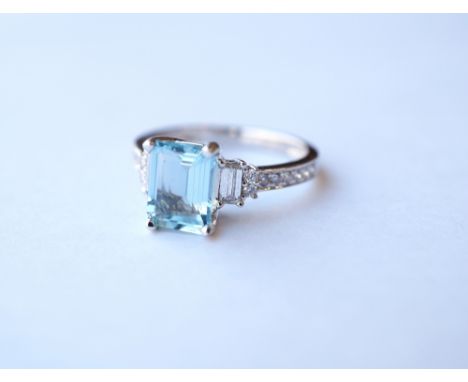 AQUAMARINE AND DIAMOND DRESS RING
the emerald cut aquamarine approximately 1.26cts flanked by diamonds to the stepped shoulde