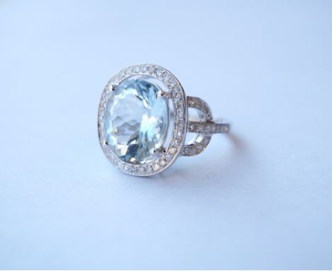 AQUAMARINE AND DIAMOND COCKTAIL RING
the central oval cut aquamarine approximately 4.7cts in diamond surround and with furthe