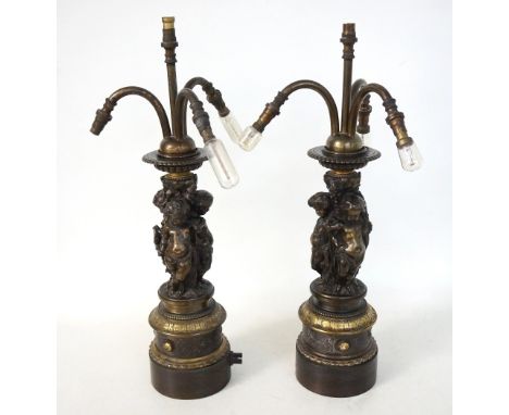 PAIR OF LATE VICTORIAN BRONZED SPELTER FIGURAL TABLE LAMPS
of multi-piece construction, the central vertical fitting within t