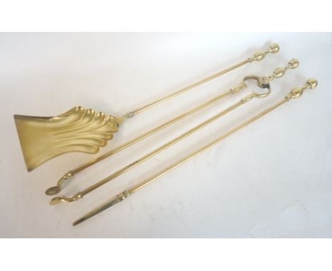 SET OF BRASS FIRE TOOLS
comprising a shaped shovel, poker and set of tongs, all with shaped finials 