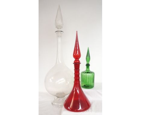 THREE CHEMIST DISPLAY MEDICINE BOTTLES
of graduated size, a clear glass bottle of baluster form with a conical faceted stoppe