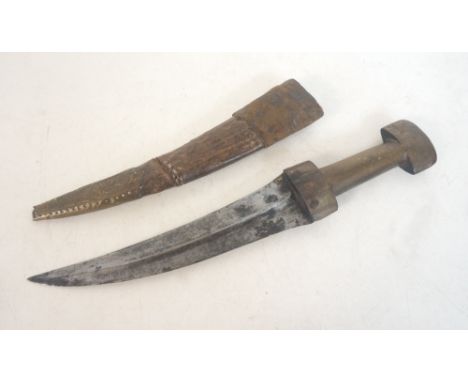 KURDISH JAMBIYA
early 20th century, with carved horn hilt, curved double-edged blade with medial ridge, and brass tipped leat