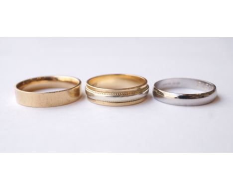 TWO NINE CARAT GOLD WEDDING BANDS
one in white and yellow gold, the other yellow gold, ring sizes T and V respectively; toget