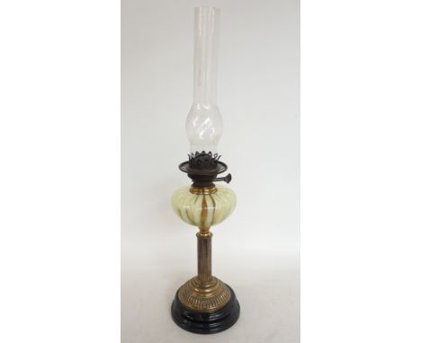 VICTORIAN OIL LAMP
raised on a stepped circular base with a gilt metal column supporting a green vaseline glass reservoir, wi