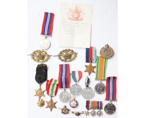 WWII BRITISH MEDALS
comprising War Medal with slip (Army) and box of issue addressed to 'Mr.D.Fraser, Glasgow', 1939-45 Star;