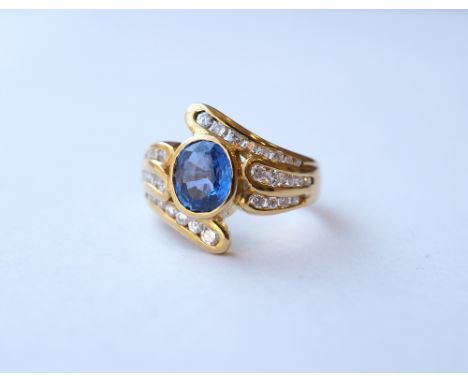 CEYLON SAPPHIRE AND DIAMOND CLUSTER DRESS RING
the central sapphire approximately 1.25cts on diamond set eighteen carat gold 