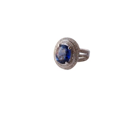 SAPPHIRE AND DIAMOND CLUSTER DRESS RING
the central oval cut sapphire approximately 3.9cts, in multi diamond surround and wit