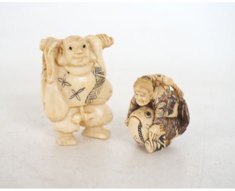 CARVED IVORY NETSUKE OF A SCHOLAR RIDING A FISH
4cm high and an ivory netsuke of a gentleman with a staff over his shoulders,