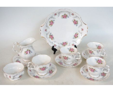 ROYAL ALBERT 'TRANQUILITY' CHINA TEA SERVICE
comprising six cups; six saucers; six side plates; sandwich plate; sugar basin a