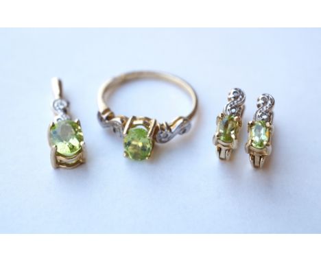 SUITE OF PERIDOT AND DIAMOND JEWELLERY
all in nine carat gold, comprising a pair of earrings, a pendant and a ring (size O)