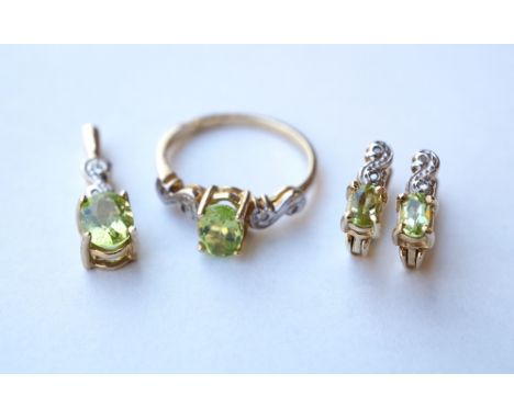 SUITE OF PERIDOT AND DIAMOND JEWELLERY
all in nine carat gold, comprising a pair of earrings, a pendant and a ring (size O)