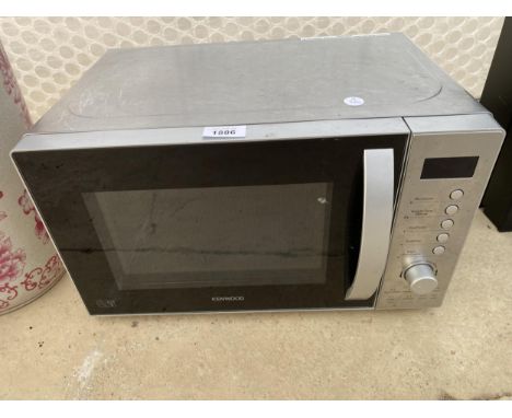 A SILVER KENWOOD MICROWAVE OVEN 