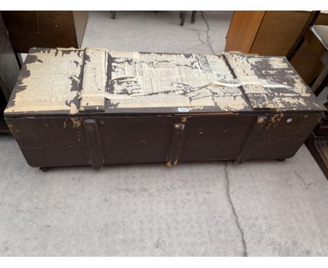 A PAINTED WOODEN STORAGE TRUNK WITH IRON CARRYING HANDLES, 48" WIDE 