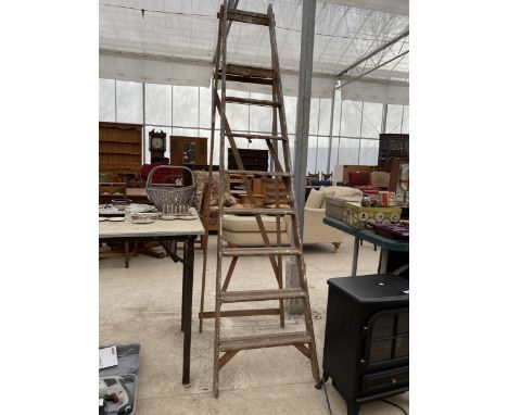 A VINTAGE SEVEN RUNG WOODEN STEP LADDER 