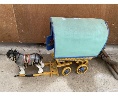 A SMALL CERAMIC SHIRE HORSE WITH ROMANY CARAVAN 