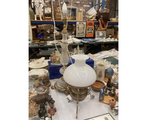 A VINTAGE BRASS OIL LAMP WITH OPAQUE SHAD THAT HAS BEEN CONVERTED TO ELECTRICITY AND A LARGE BRASS AND GLASS TABLE LAMP WITH 