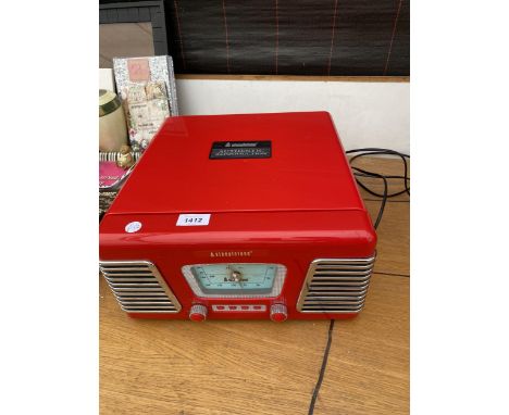 A STEEPLETONE RECORD PLAYER WITH BUILT IN SPEAKERS 