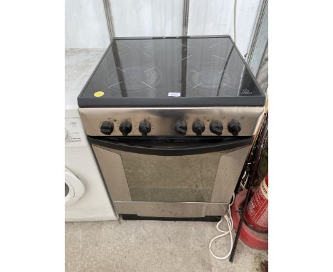 A SILVER AND BLACK INDESIT ELECTRIC OVEN AND HOB 