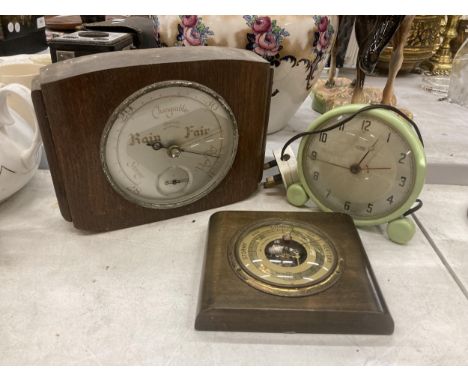 A VINTAGE METAMEC ALARM CLOCK AND TWO MAHOGANY CASED BAAROMETERS 