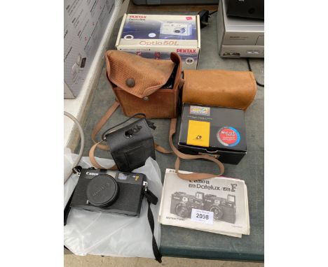 AN ASSORTMENT OF CAMERA EQUIPMENT TO INCLUDE A KODAK BROWNIE AND TWO CANON CAMERAS 