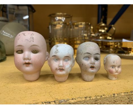 FOUR VINTAGE BISQUE DOLLS HEADS TO INCLUDE ONE MARKED GERMANY WITH THE NUMBER 395 A.100 M, A CEUS, GERMANY 20/0, AND TWO WITH