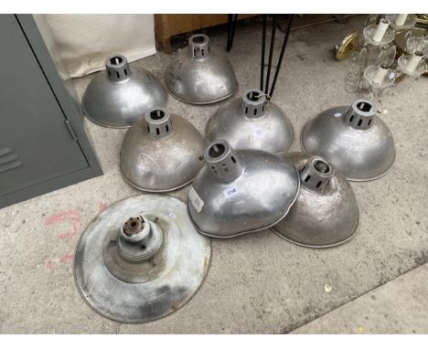 AN ASSORTMENT OF INDUSTRIAL STYLE STAINLESS STEEL LIGHT SHADES 