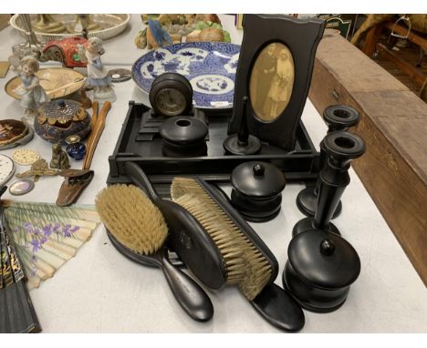 A VINTAGE 'BLACK PRINCE GABOON' EBONY DRESSING TABLE SET TO INCLUDE A TRAY, BRUSHES, HAND MIRROR, A CLOCK, PHOTO FRAME RING H