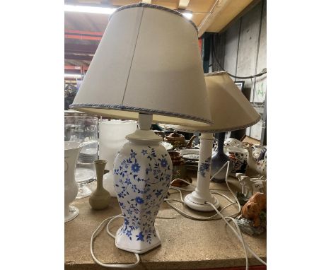TWO CERAMIC BLUE AND WHITE FLORAL LAMPS WITH CREAM AND BLUE AND WHITE TRIM SHADES 