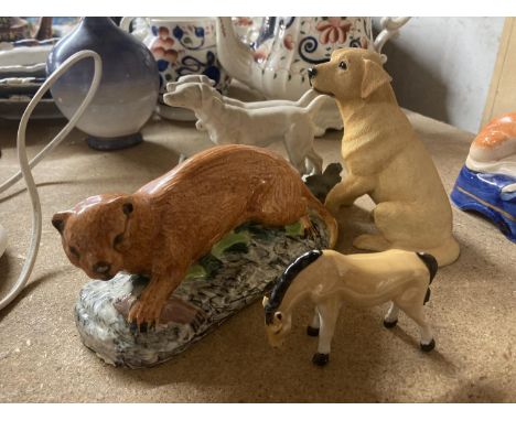 FOUR  CERAMIC ANIMALS TO INCLUDE A LEONARDO GOLDEN LABRADOR, OTTER, TWO DOGS ON A STAND AND A HORSE 