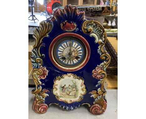 A VINTAGE CONTINENTAL POTTERY CLOCK WITH HAND PAINTED DIAL, HEIGHT 33CM 