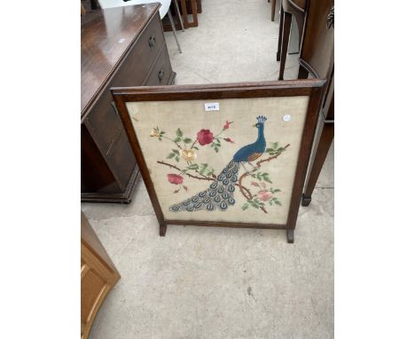 A FOLDING 'LOGAN FURNITURE' TABLE/FIRESCREEN WITH WOOLWORK TOP DEPICTING A PEACOCK 