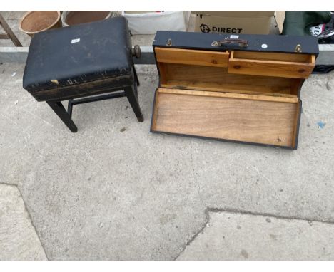 A BLACK PAINTED ADJUSTABLE PIANO STOOL AND TOOL CHEST WITH TWO DRAWERS 