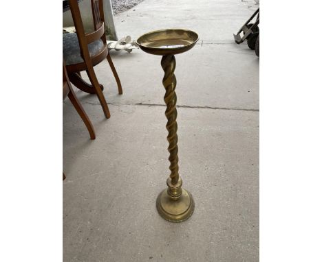 A BRASS ASHTRAY STAND ON BARLEYTWIST COLUMN 