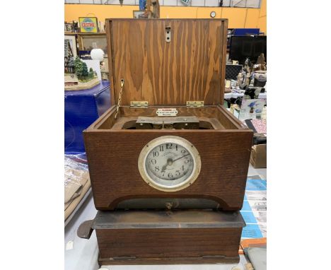 A VINTAGE 'BLICK TIME RECORDERS' CLOCKING IN CLOCK IN A MAHOGANY CASE 
