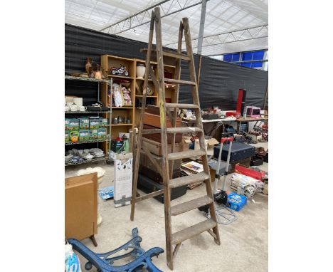 A VINTAGE SEVEN RUNG WOODEN STEP LADDER 