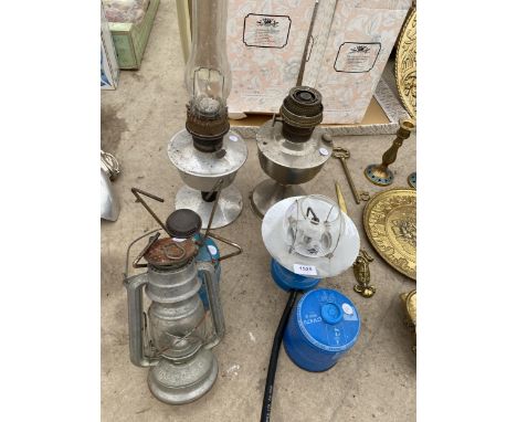 AN ASSORTMENT OF CAMPING STOVES, OIL LAMPS AND A PARAFIN LAMP ETC 