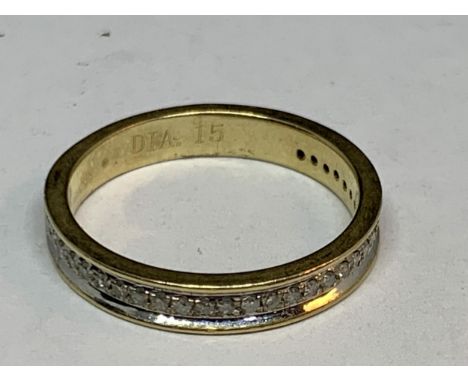 A 9 CART GOLD RING WITH A BAND OF DIAMONDS SIZE K 