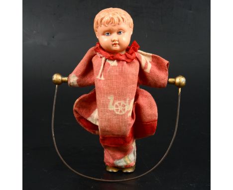 Buschow &amp; Beck, Germany, celluloid head, clock-work skipping doll, original clothing, pat no. 193168, 15cm.