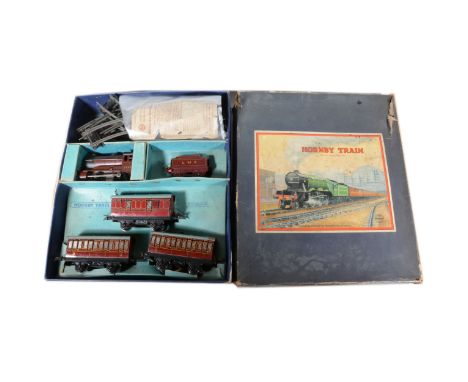 Hornby O gauge model railway no.501 passenger set, with LMS 5600 clock-work locomotive in maroon; three LMS passenger coaches