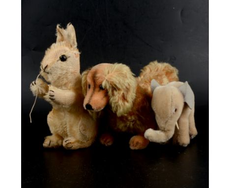 Three Steiff, Germany, plush animal toys; including long haired Sausage dog, 28cm (no tag); elephant, 12cm (no tag); squirrel