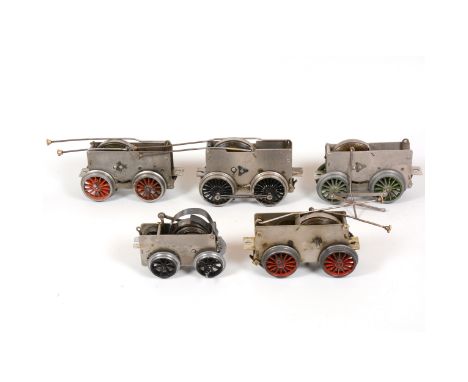 Six Hornby O gauge model railway clock-work motor chassis for locomotives, all loose.