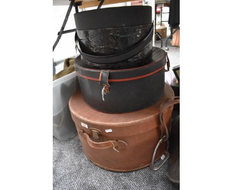 A large vintage leather effect hatbox and two other hatboxes.