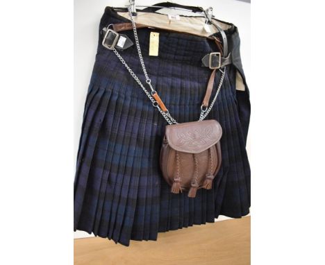 A vintage kilt in green and blue (32 inch waist approx) having some moth damage.