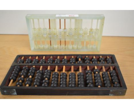A jadeite two tier abacus, measuring 23cm long, and another abacus