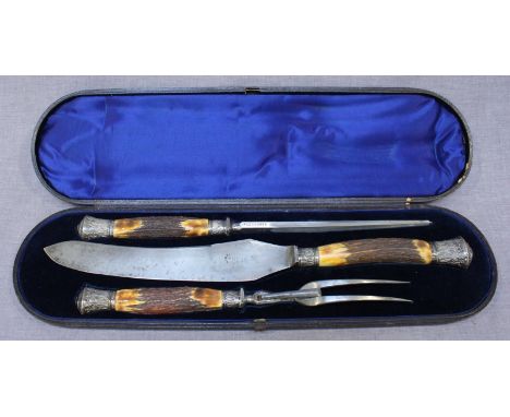 A Victorian Silver mounted antler-handled Carving set comprising Carving knife, fork and steel, silver mounts hallmarked Shef