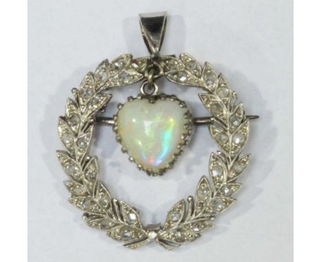 A platinum laurel wreath brooch set with rose cut diamonds, with a central heart shaped opal drop.